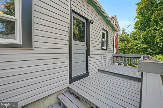a view of a wooden deck and a yard