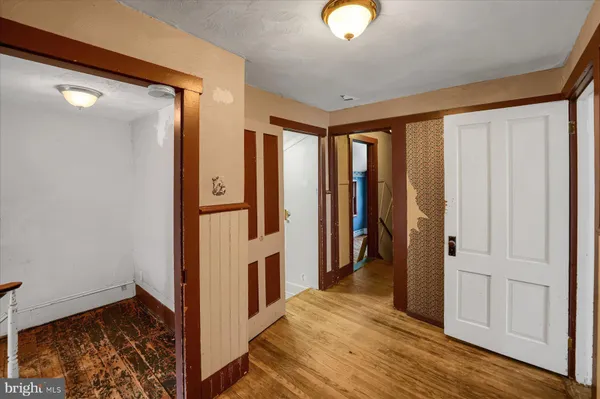 a view of entryway with wooden floor