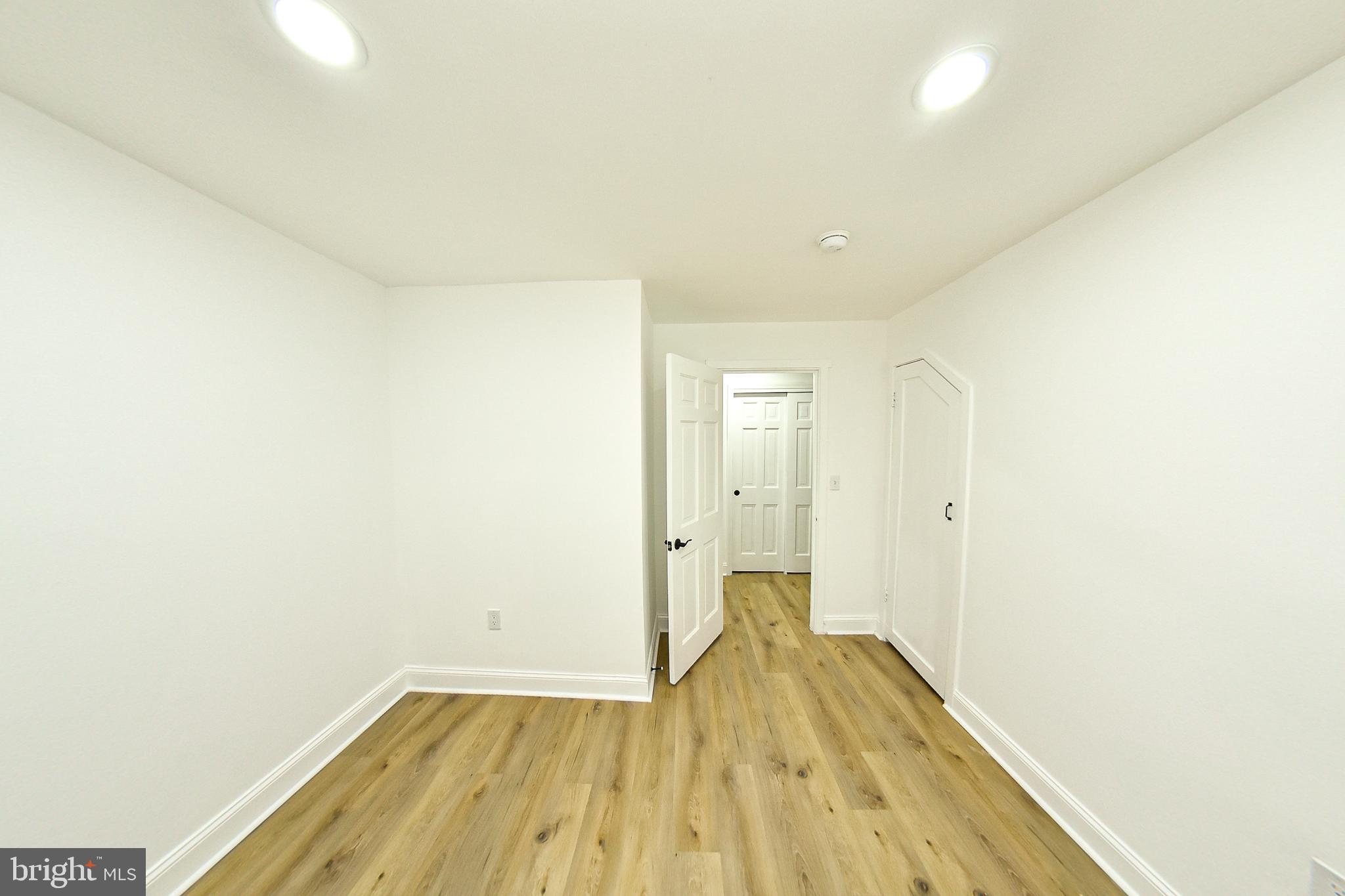 3704 Suitland Road Southeast Washington, DC 20020 - Photo 41 of 70 a view of a room with wooden floor and a ceiling fan