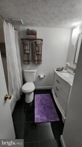 a bathroom with a toilet and a sink