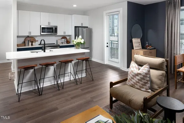 a bathroom with a sink a mirror and shower