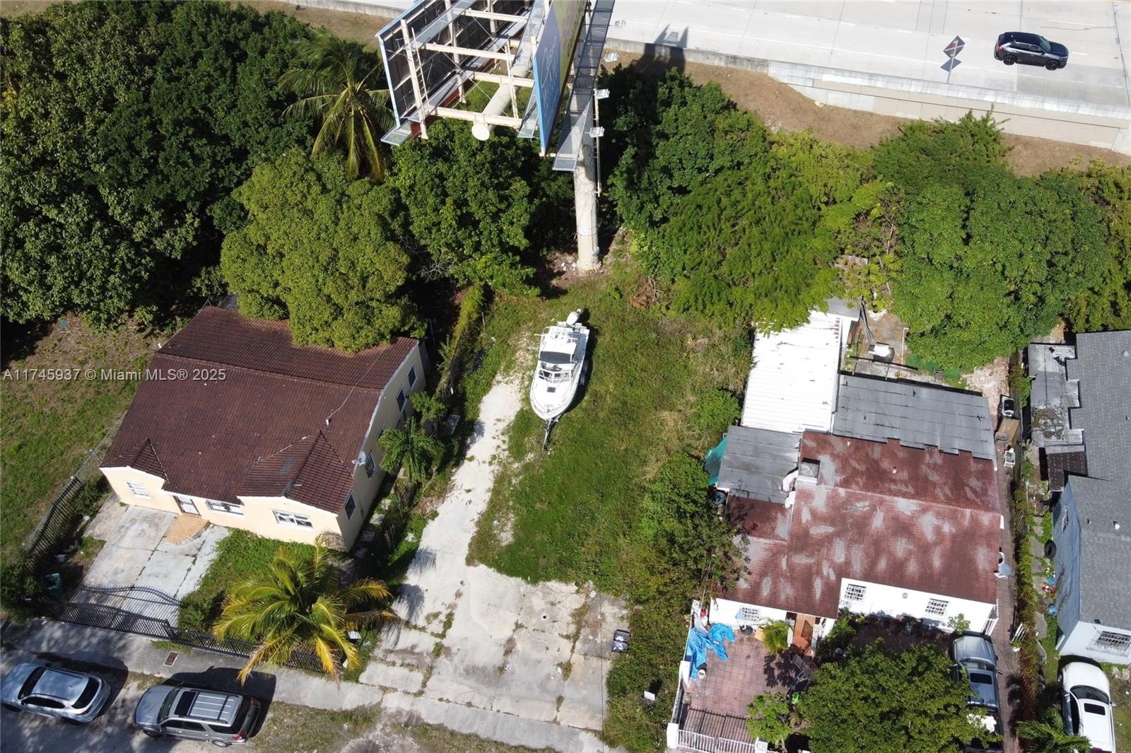 an aerial view of multiple houses with yard