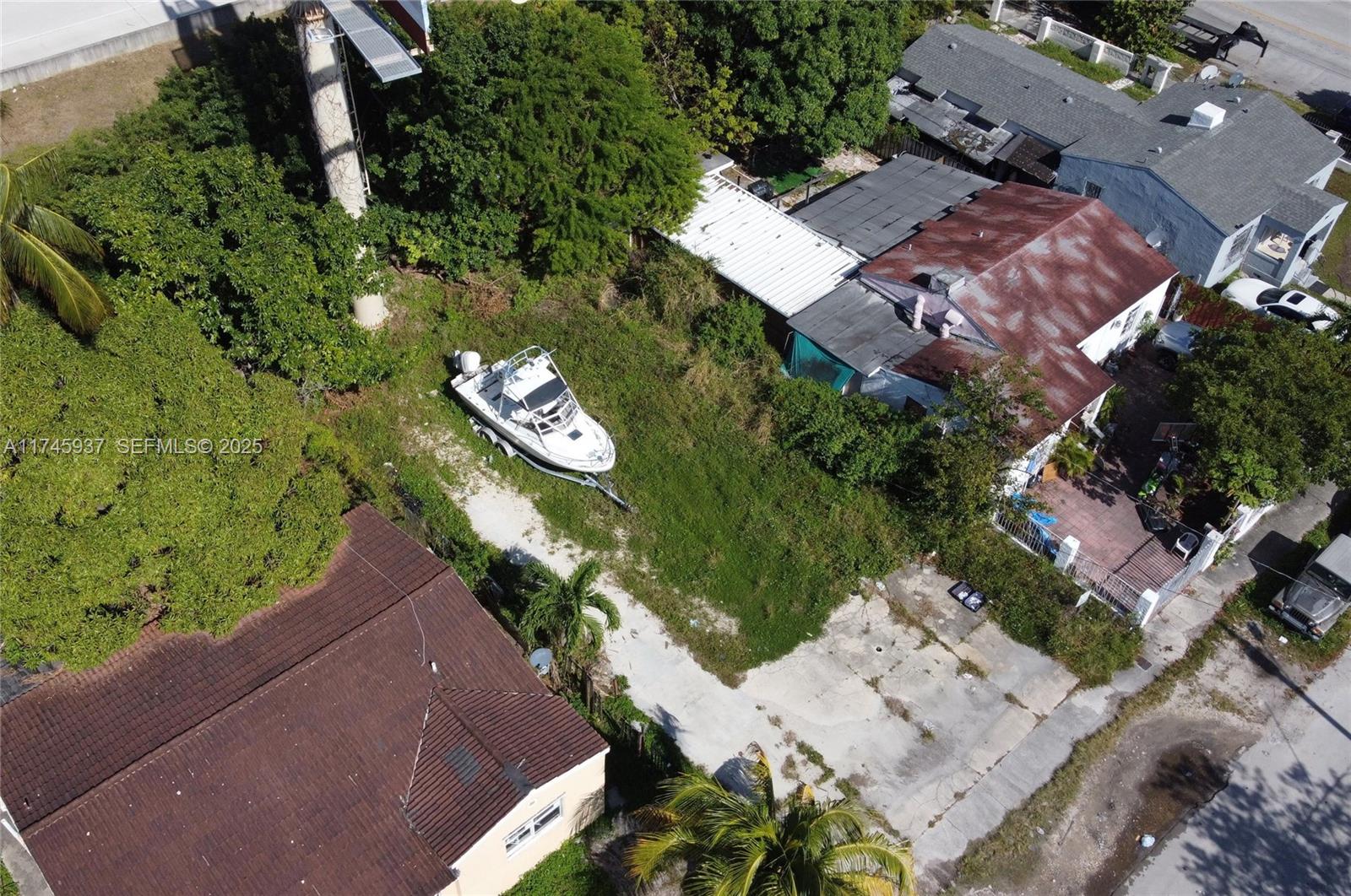 321 Northwest 37th Street Miami, FL 33127 - Photo 14 of 49 an aerial view of a house with a yard basket ball court and outdoor seating