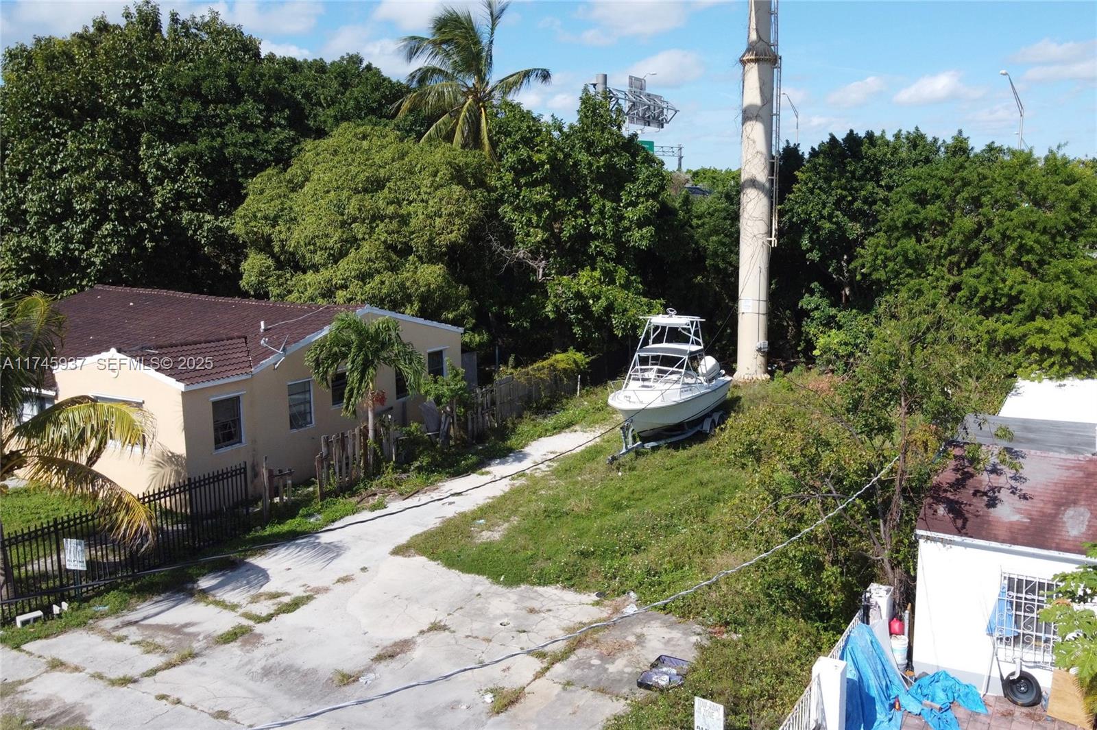 321 Northwest 37th Street Miami, FL 33127 - Photo 18 of 49 a backyard of a house with a yard and outdoor seating