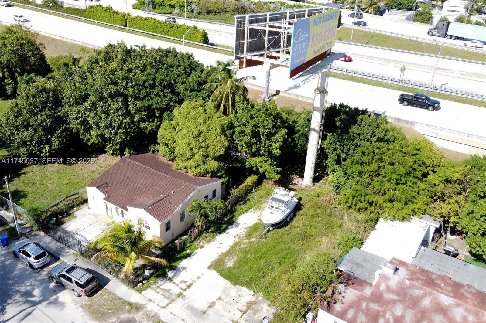 321 Northwest 37th Street Miami, FL 33127 - Photo 29 of 49 a view of a house with a yard