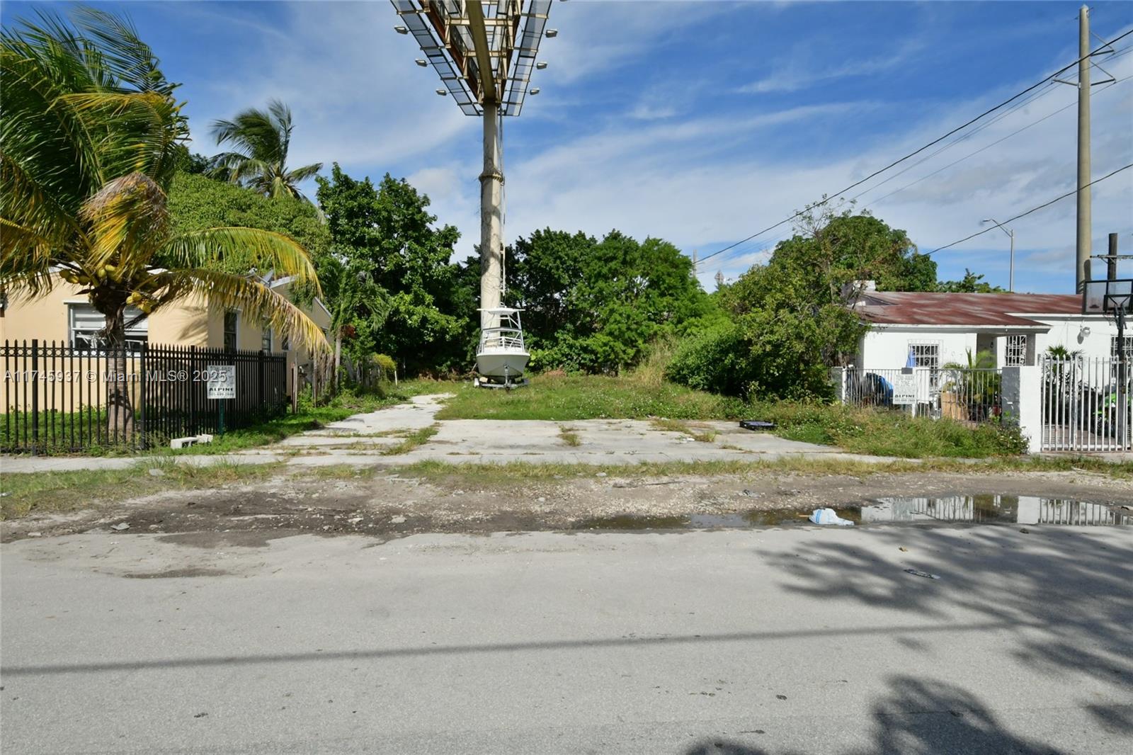 321 Northwest 37th Street Miami, FL 33127 - Photo 30 of 49 a view of a house with a yard and palm trees