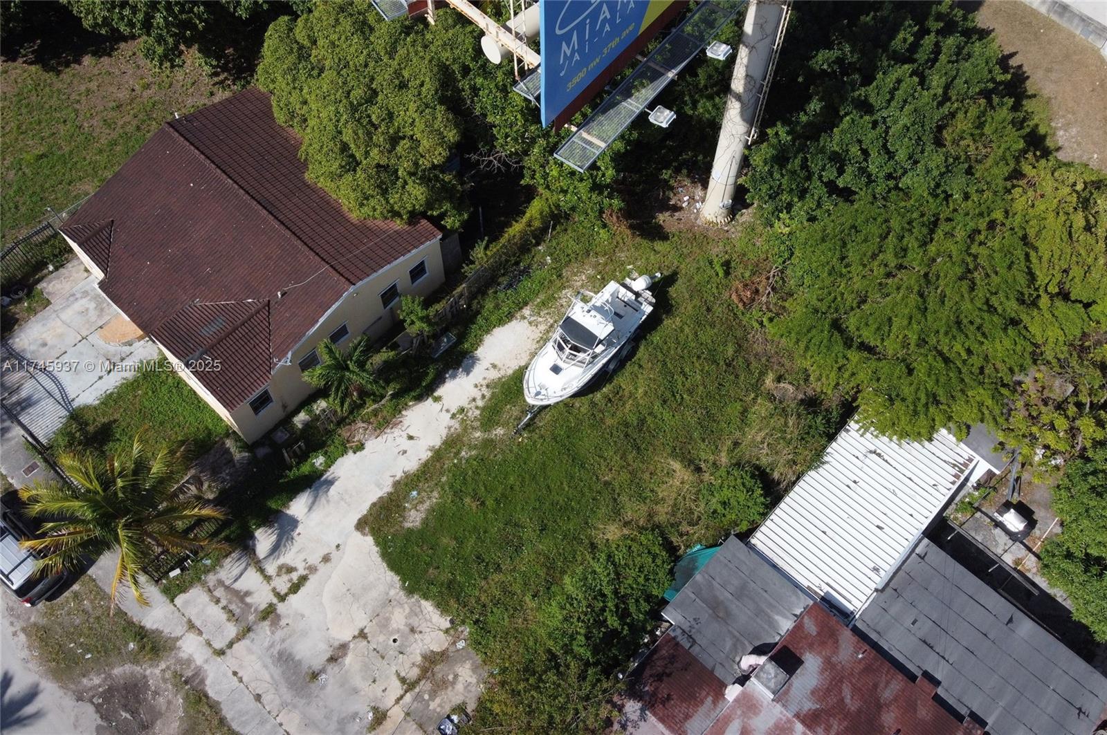 321 Northwest 37th Street Miami, FL 33127 - Photo 3 of 49 an aerial view of a house with a yard swimming pool and outdoor seating