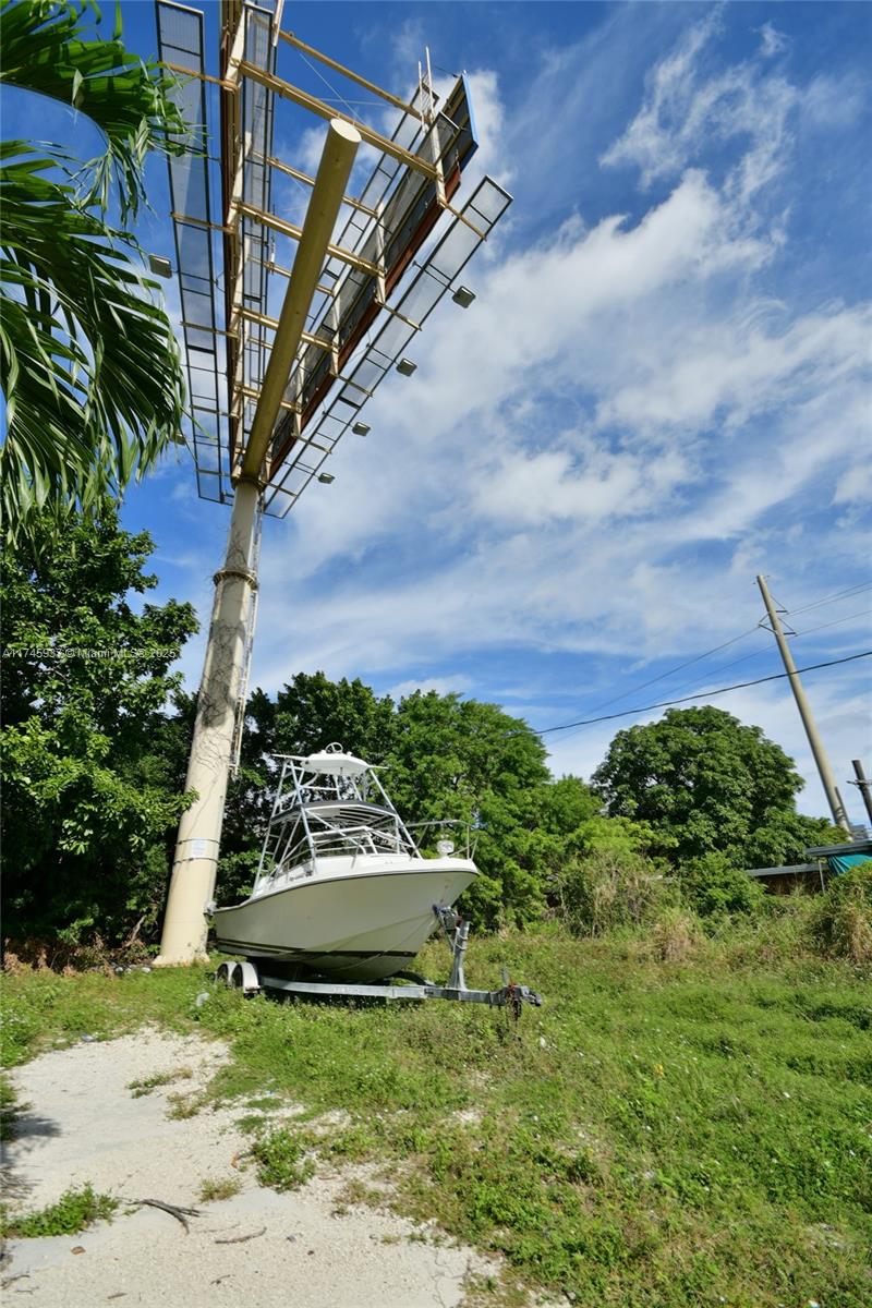 321 Northwest 37th Street Miami, FL 33127 - Photo 39 of 49 a view of a small house in the middle of a yard