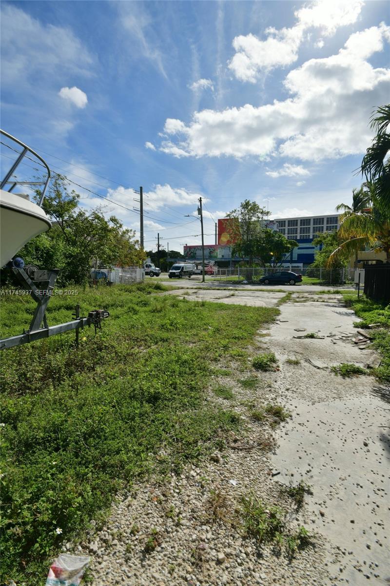 321 Northwest 37th Street Miami, FL 33127 - Photo 41 of 49 a view of a big yard with plants and a lake view