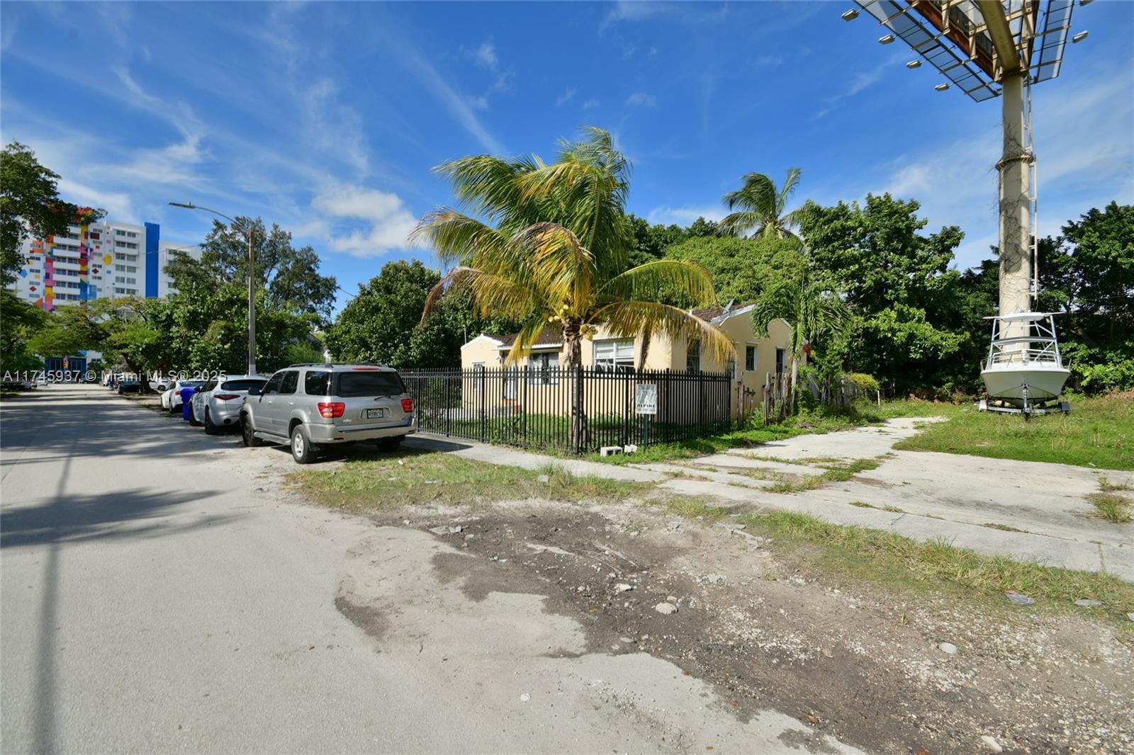 321 Northwest 37th Street Miami, FL 33127 - Photo 43 of 49 a house with a trees in front of it