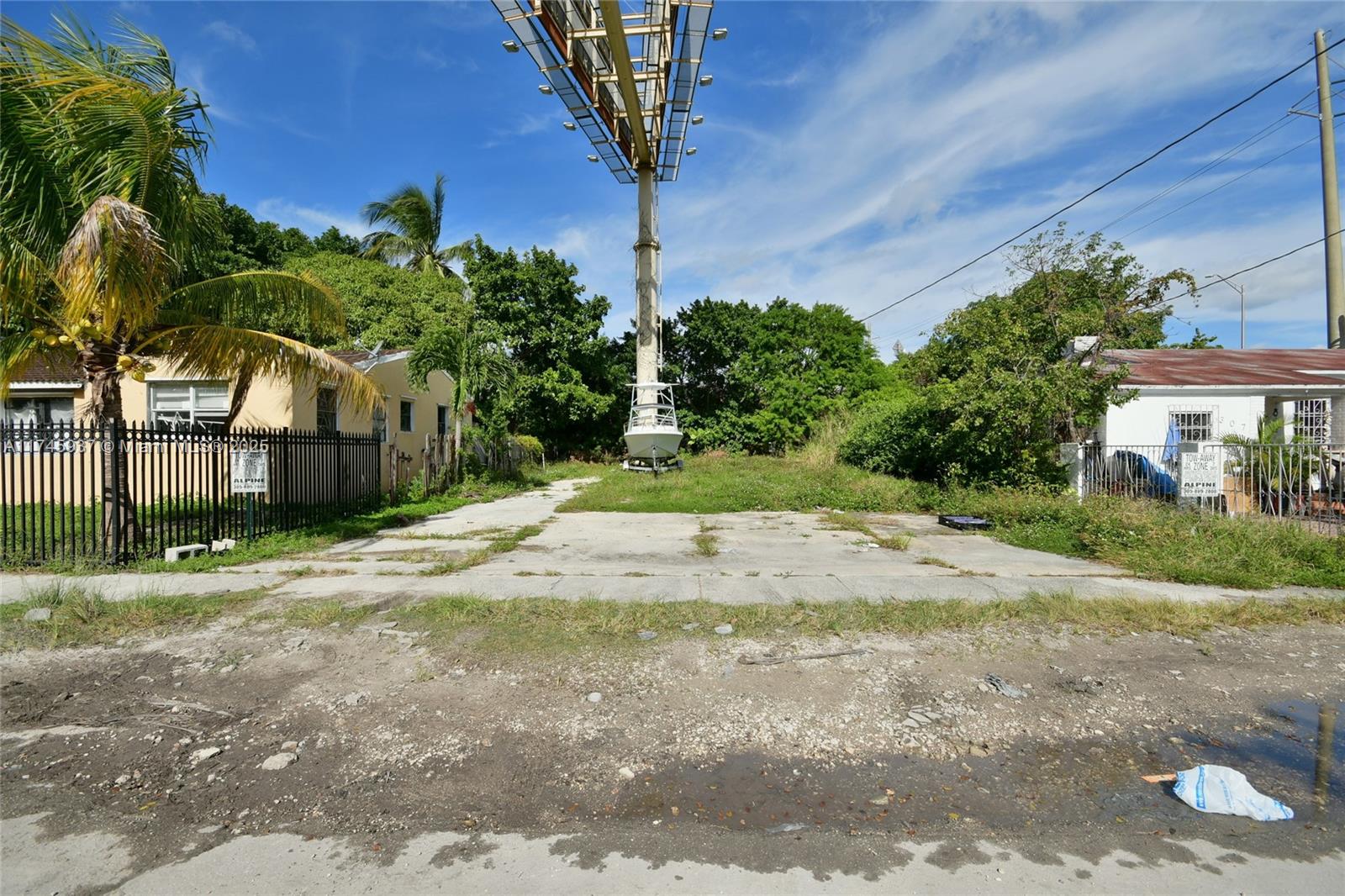 321 Northwest 37th Street Miami, FL 33127 - Photo 44 of 49 a view of a yard with plants and trees