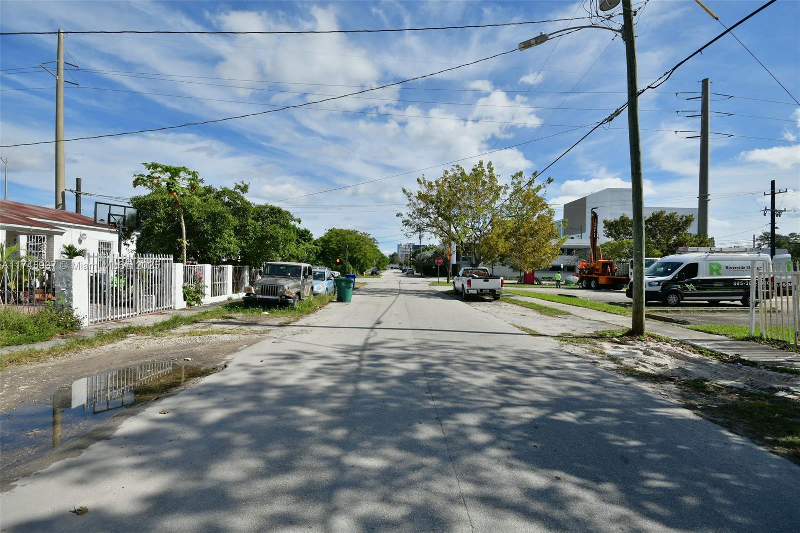 321 Northwest 37th Street Miami, FL 33127 - Photo 46 of 49 a view of a street with a cars park side of a road