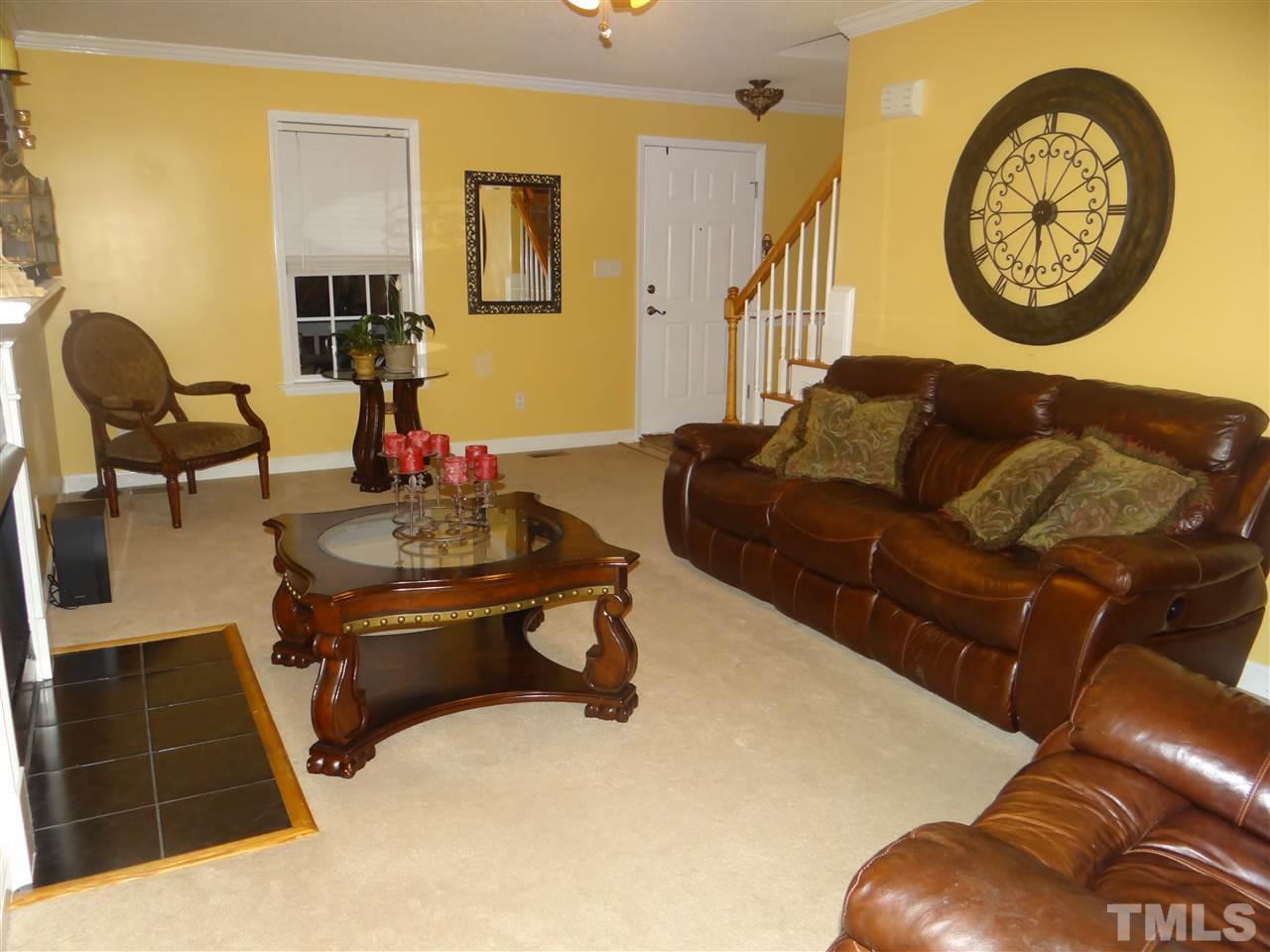 4208 Wolftrap Road Raleigh, NC 27616 - Photo 11 of 23 a living room with couch and a table