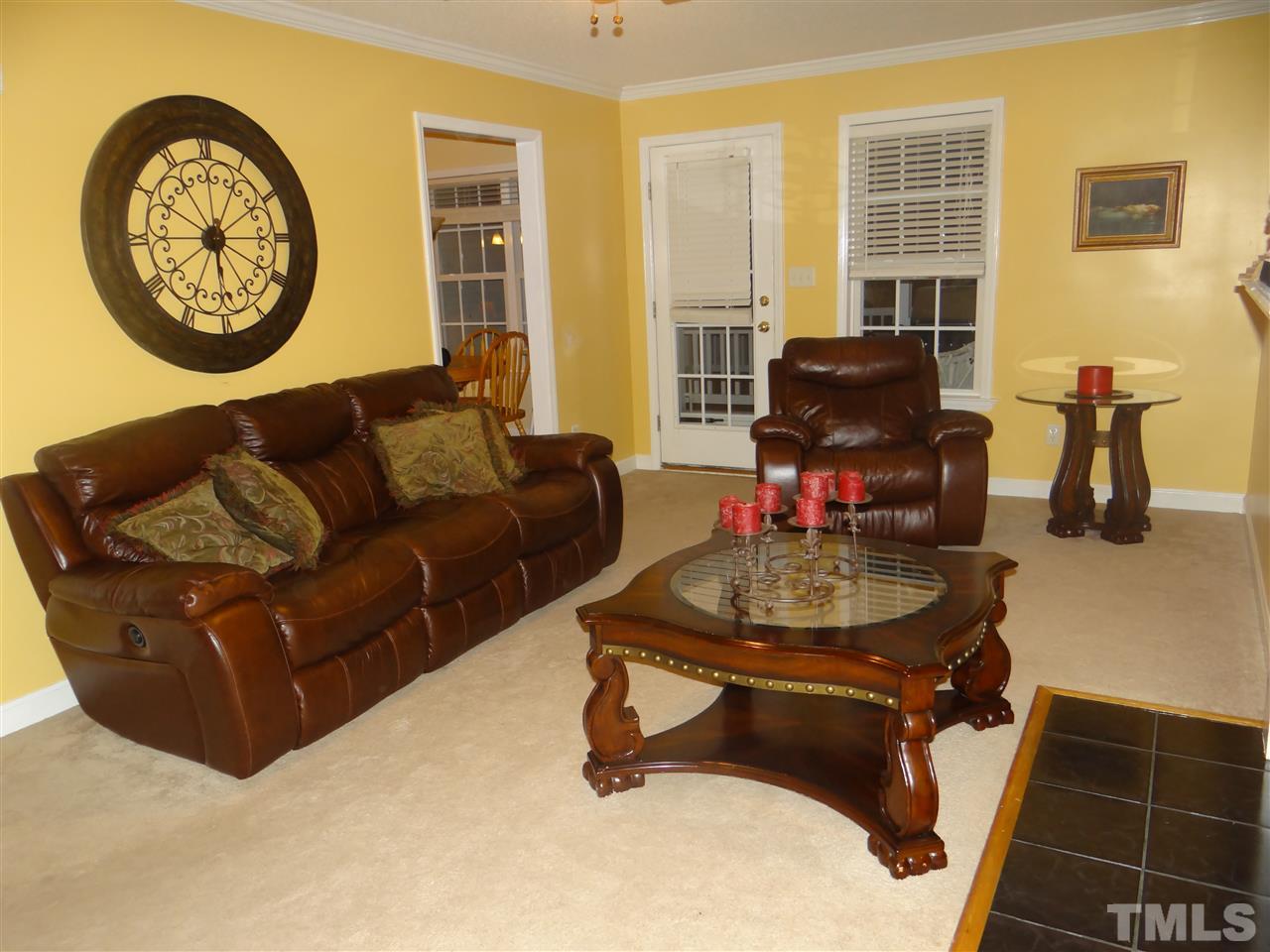 4208 Wolftrap Road Raleigh, NC 27616 - Photo 13 of 23 a living room with furniture a window and a flat screen tv
