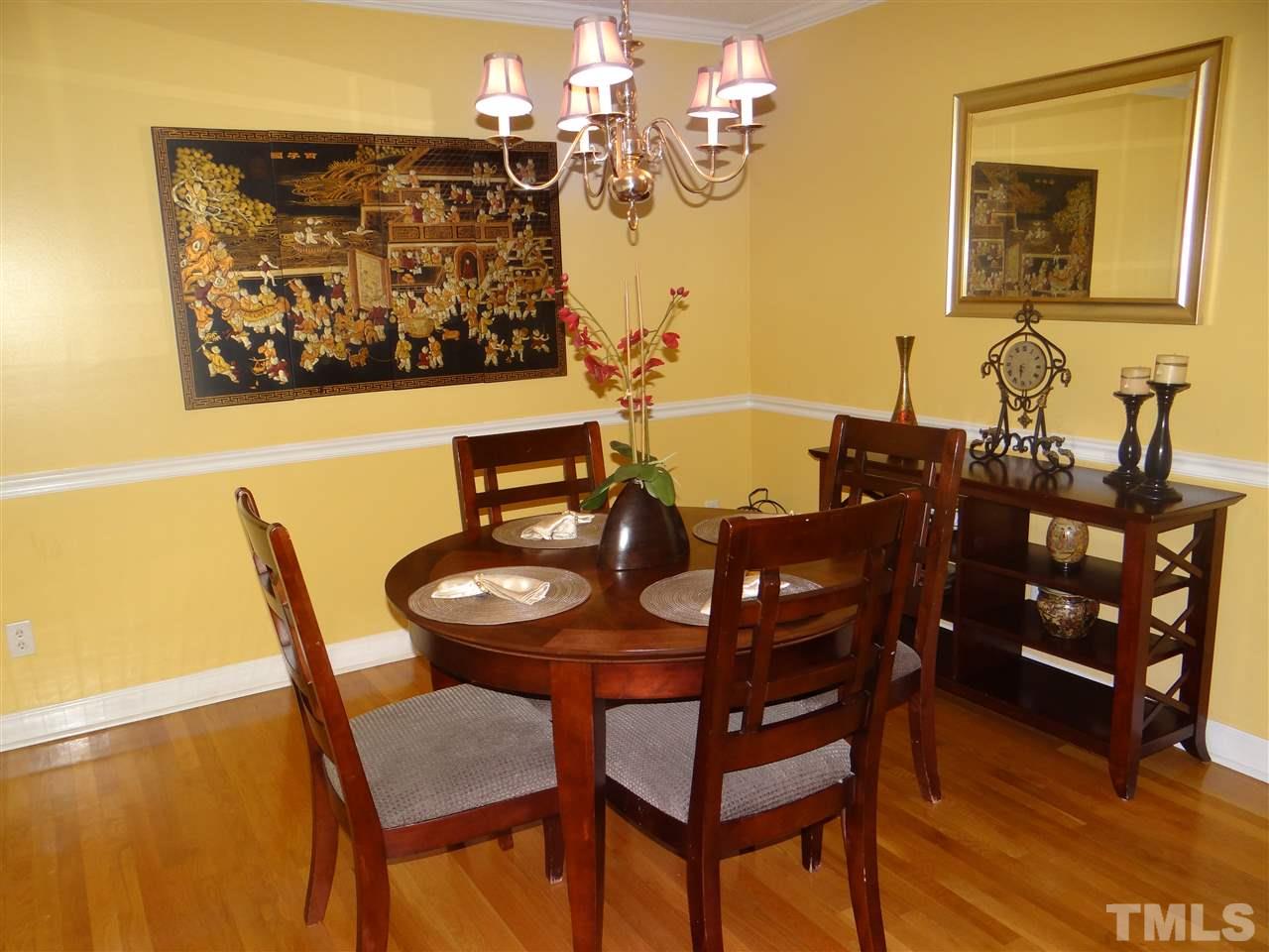 4208 Wolftrap Road Raleigh, NC 27616 - Photo 14 of 23 a view of a dining room with furniture and wooden floor