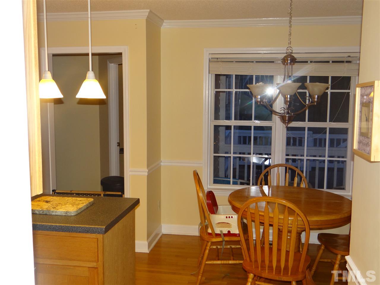 4208 Wolftrap Road Raleigh, NC 27616 - Photo 8 of 23 a dining room with furniture and window