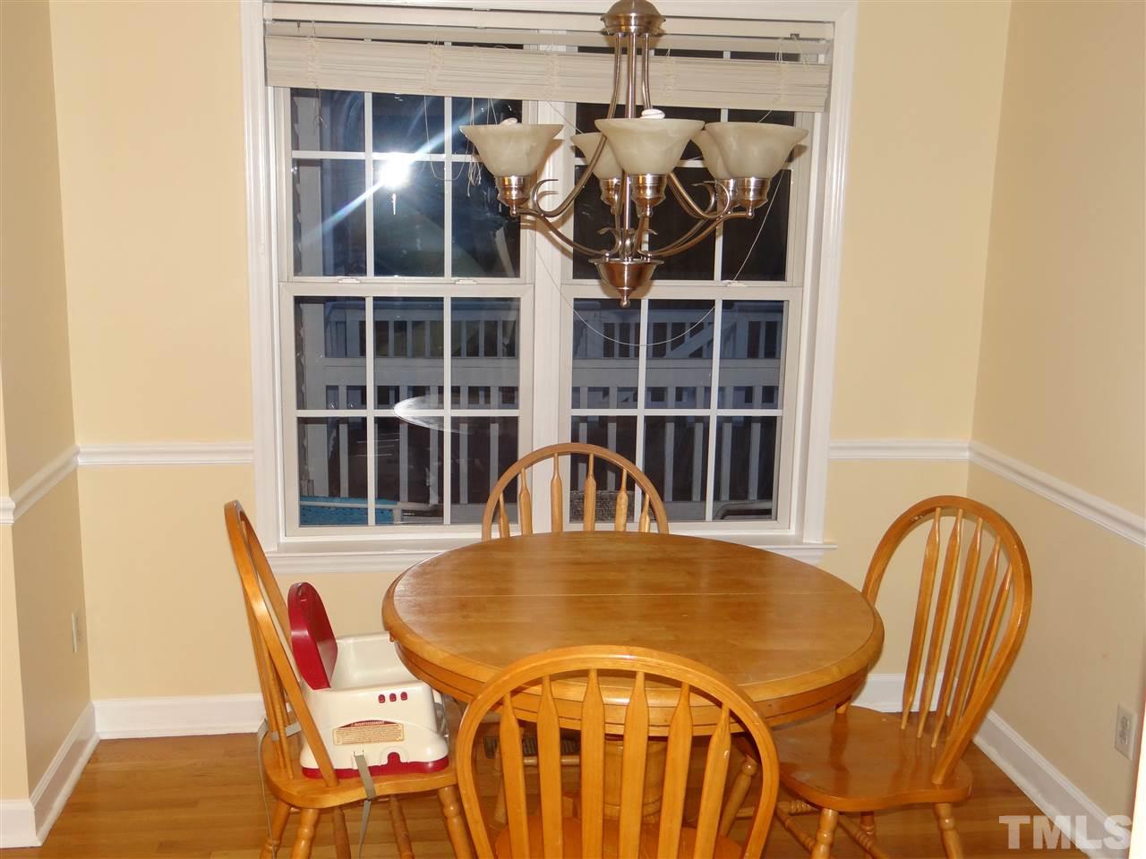 4208 Wolftrap Road Raleigh, NC 27616 - Photo 9 of 23 a view of a dining room with furniture and window