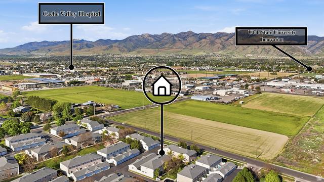 99 Penhurst Place Logan, UT 84341 - Photo 28 of 34 Aerial perspective of a developed community with mountain backdrops