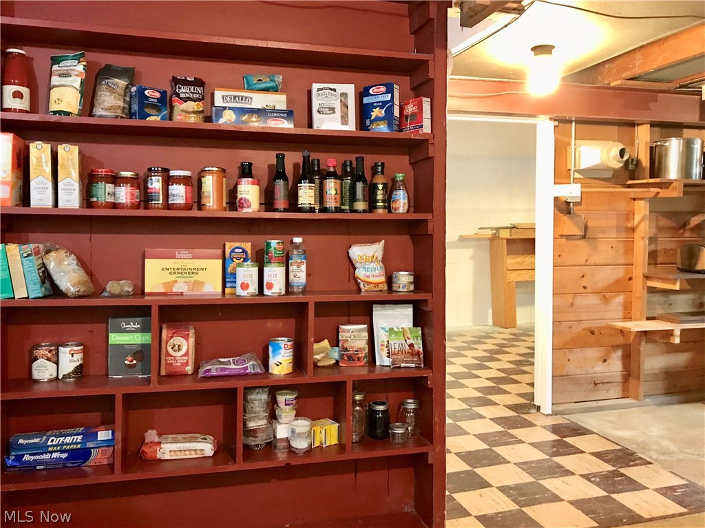 1189 Sunset Road Cleveland, OH 44124 - Photo 16 of 22 Built in shelves in the workshop of the basement.