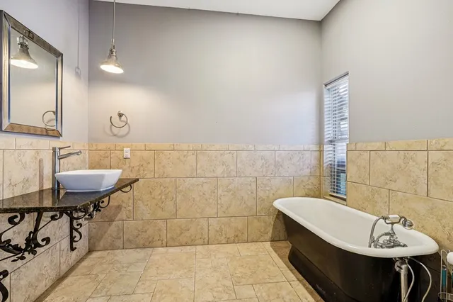 a view of a two chairs in the balcony