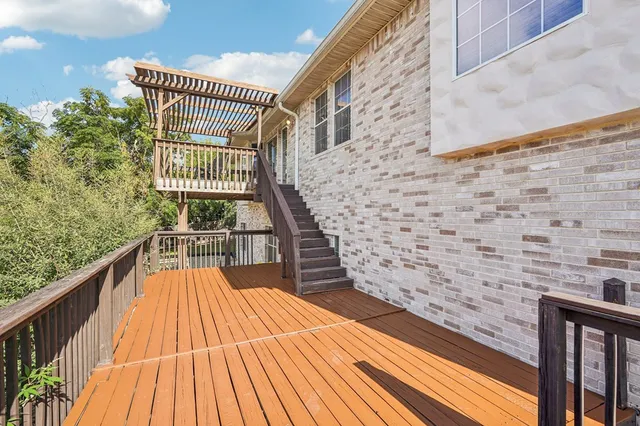 a view of balcony with wooden floor