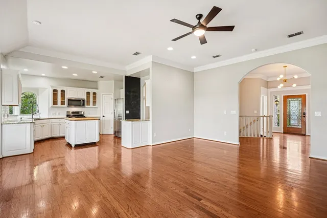 a view of kitchen with cabinets and wooden floor