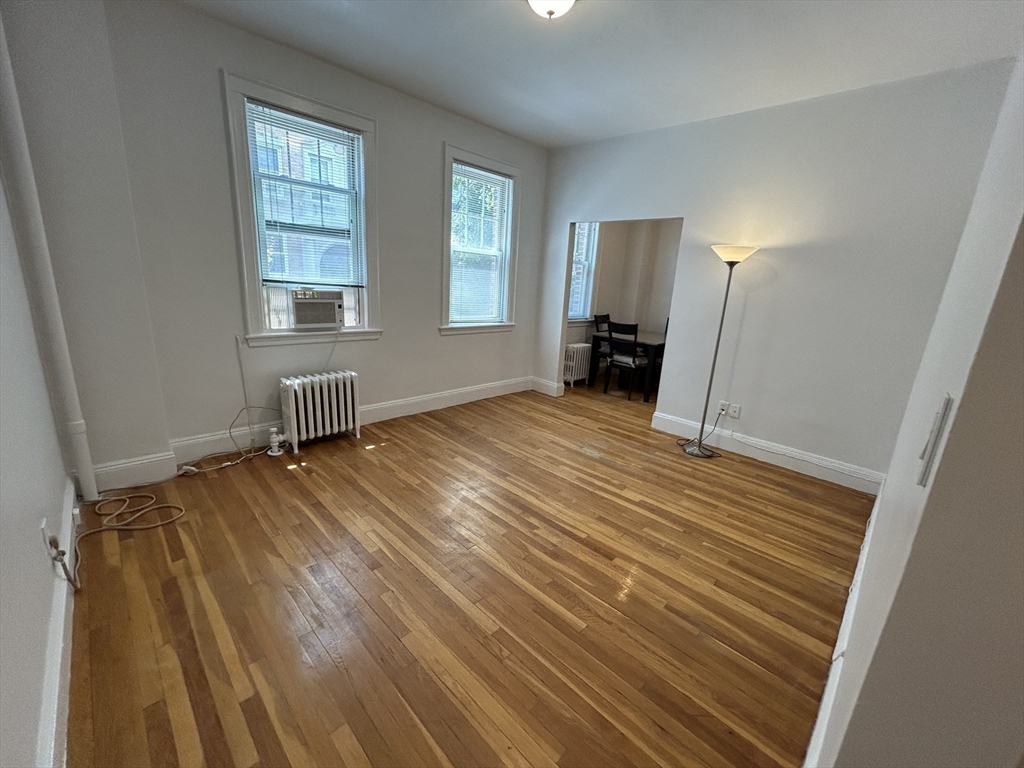 48 Strathmore Road, Unit 4 Boston, MA 02135 - Photo 3 of 10 an empty room with windows