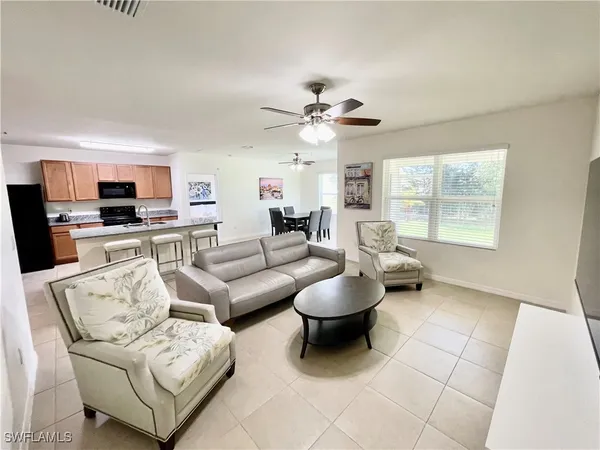 a living room with furniture and a window