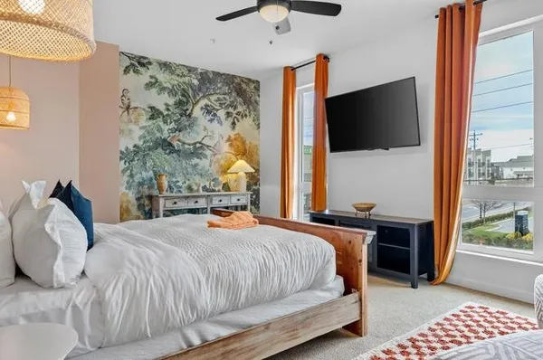 a bed room with a bed and a chair