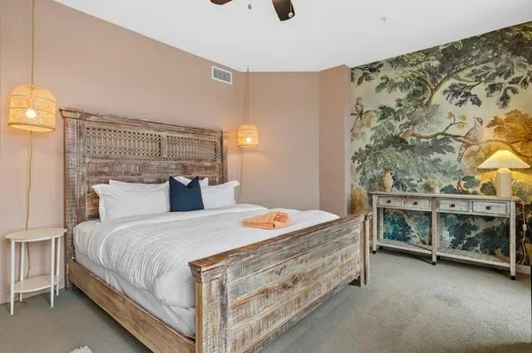 a bedroom with a bed and a flat screen tv