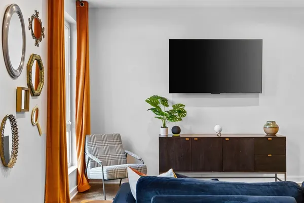 a living room with furniture and a flat screen tv