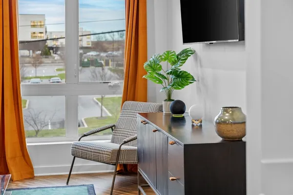 a view of a workspace with a window and chair