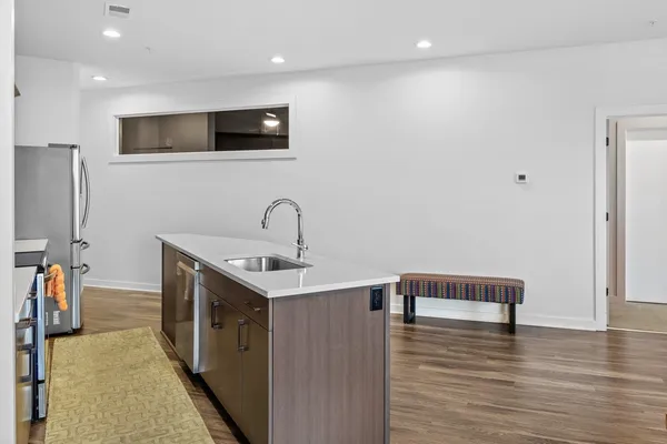 a bedroom with a bed and lamp