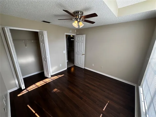a view of a room with gym equipment and a large window