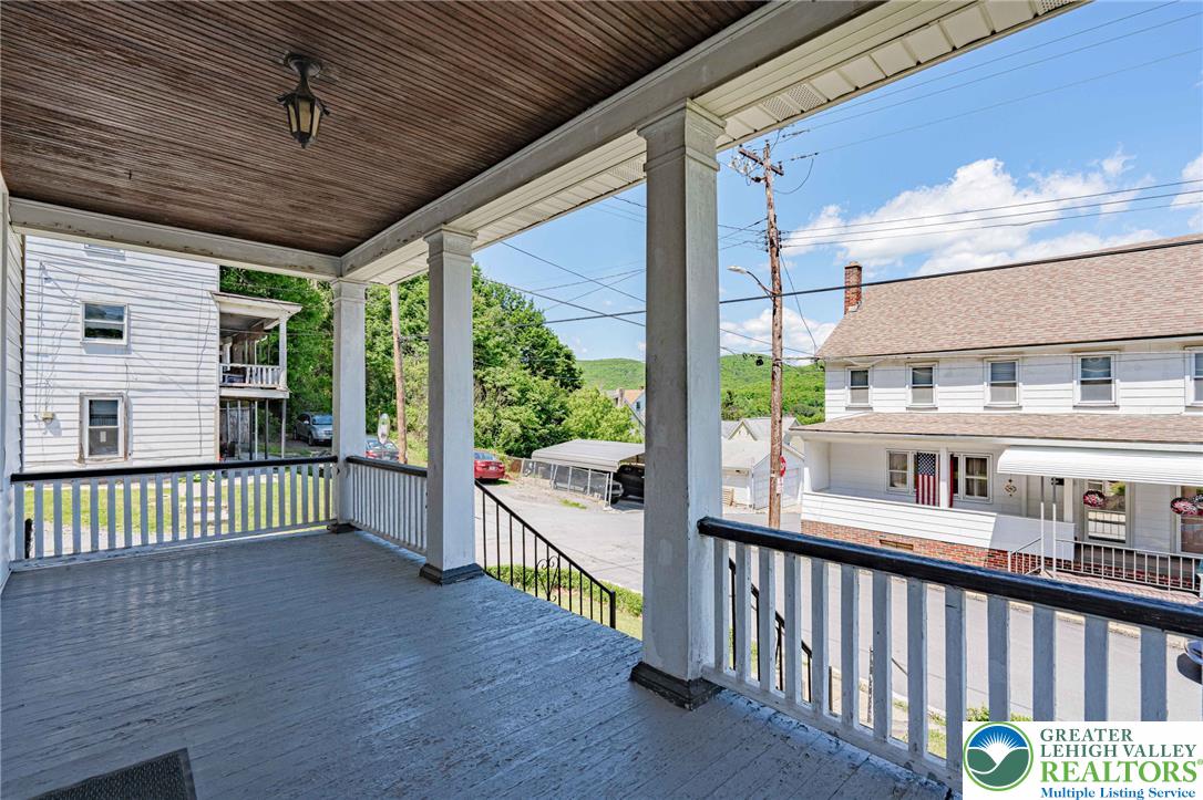 159 West Ridge Street Nesquehoning, PA 18240 - Photo 5 of 55 A classic porch with a charming view of the surrounding neighborhood and verdant hills.