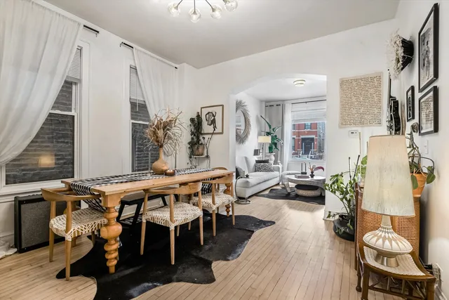 a view of a dining room with furniture and wooden floor