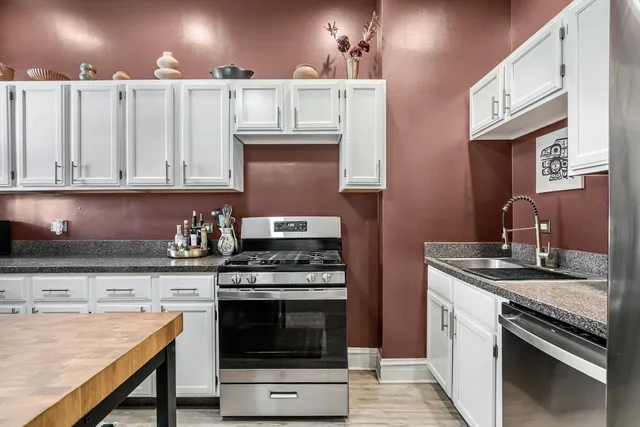 a kitchen with a stove and a sink