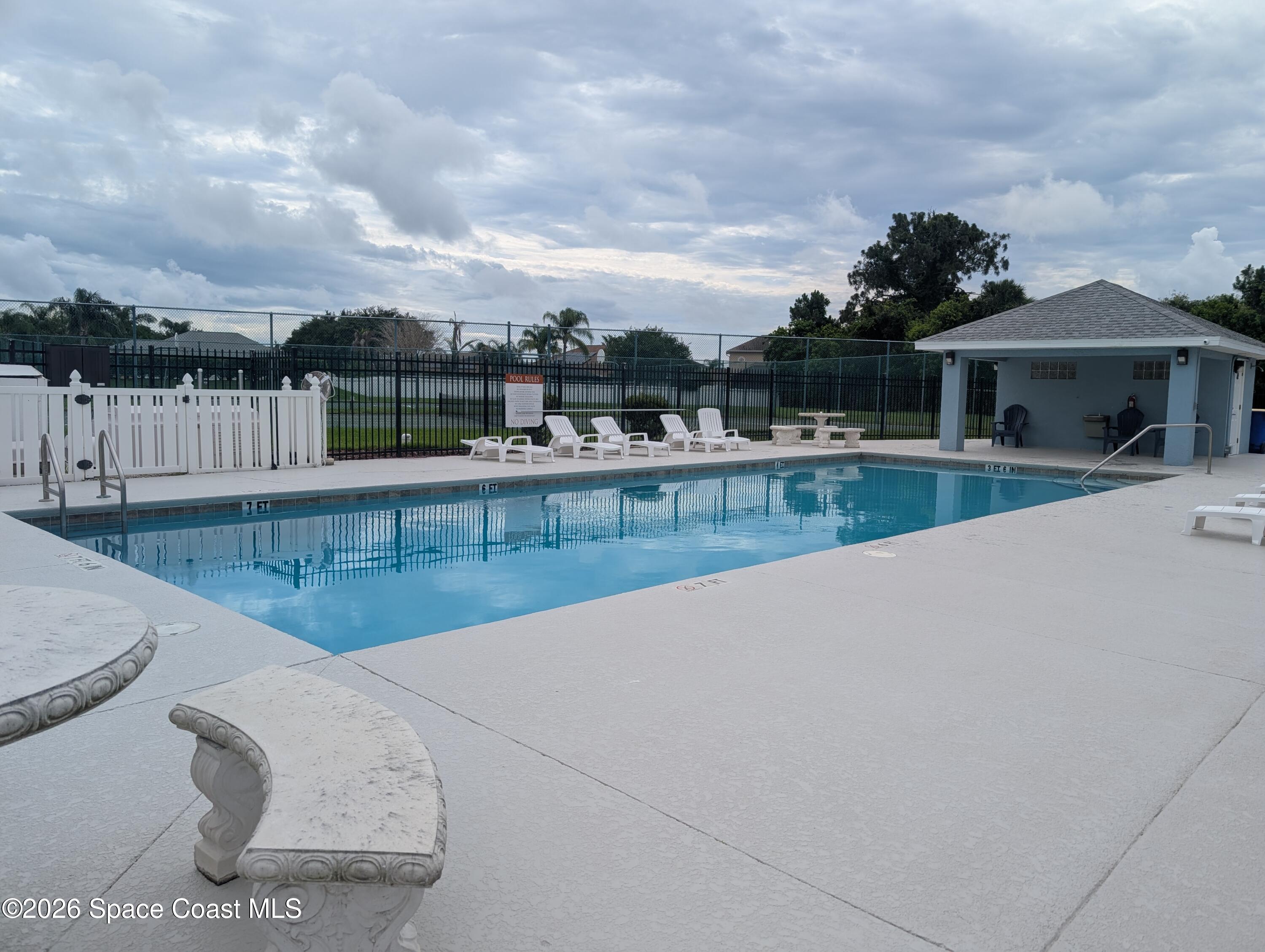 4130 Orion Way Rockledge, FL 32955 - Photo 7 of 14 a view of swimming pool with a yard