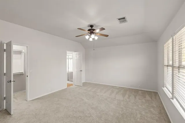 a view of an empty room with a window