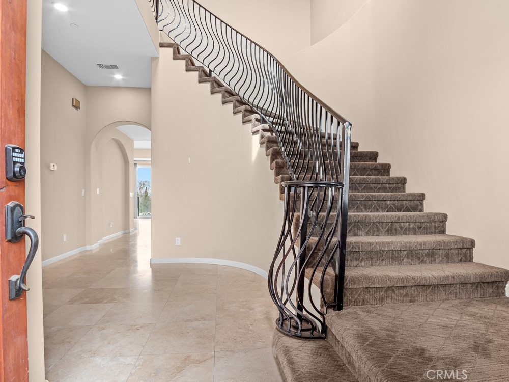 568 Vía Pueblo Riverside, CA 92507 - Photo 4 of 46 Grand staircase accented with ornate wrought-iron railings.