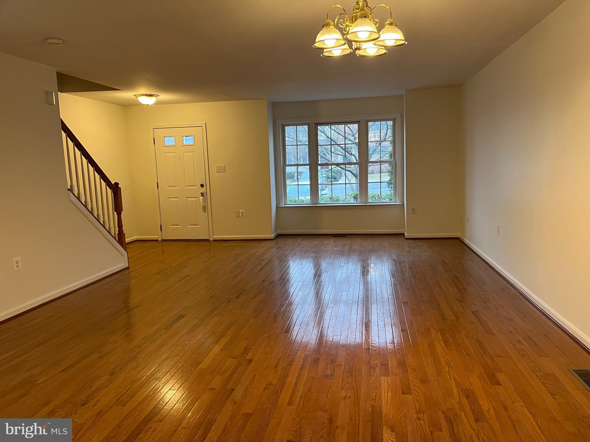 20 Mabel Lane Martinsburg, WV 25404 - Photo 5 of 30 a view of an empty room with wooden floor and a window