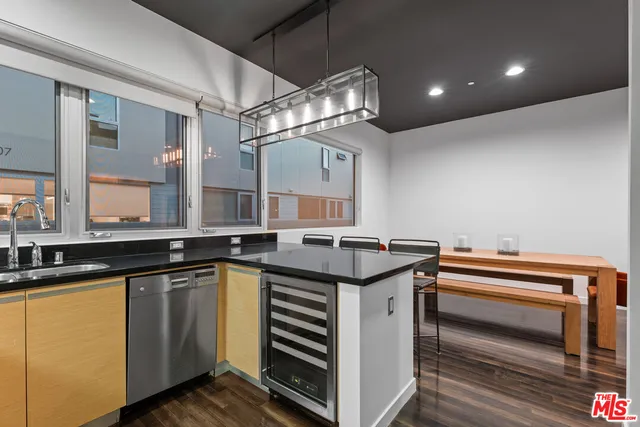 a kitchen that has a sink and a stove