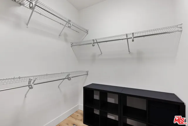 a view of a room with racks on the wall