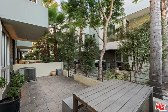 a view of a backyard with sitting area