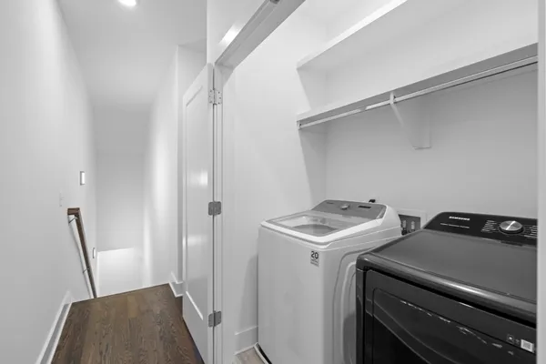 a utility room with closet dryer and washer