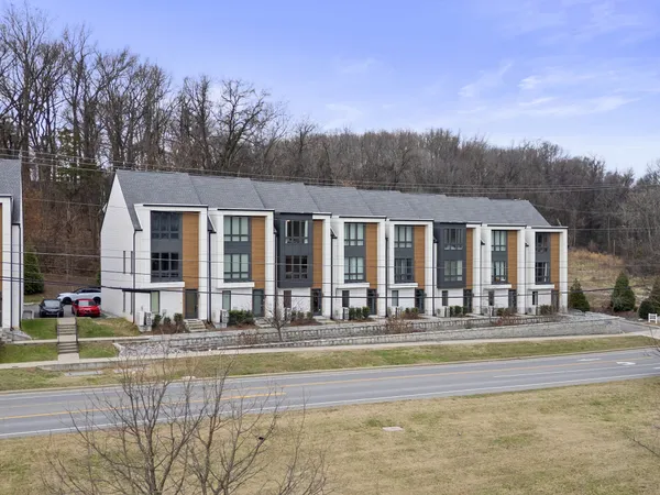 a front view of house with yard and seating space
