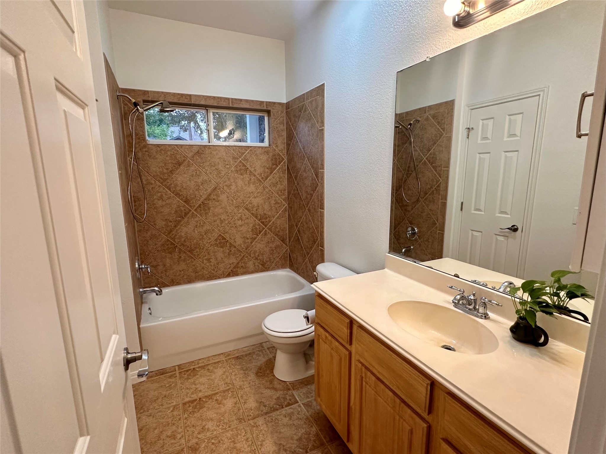 1122 Mansell Avenue Austin, TX 78721 - Photo 21 of 29 a bathroom with a sink a toilet and shower