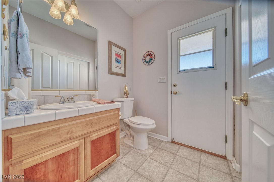 660 Indian Road Pahrump, NV 89048 - Photo 34 of 54 Bathroom 3. This is a half bath. Door leads to covered patio. Additional linen/towel storage out of sight on the right side.