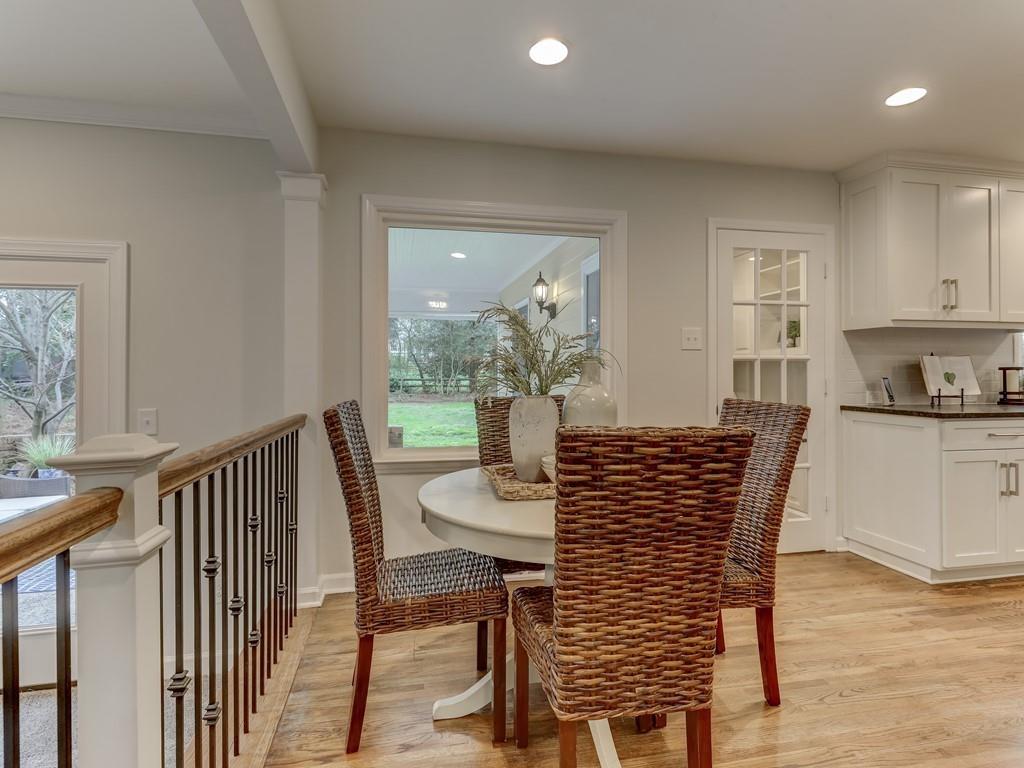 4234 Chevington Road Charlotte, NC 28226 - Photo 18 of 46 a view of a dining room with furniture window and wooden floor