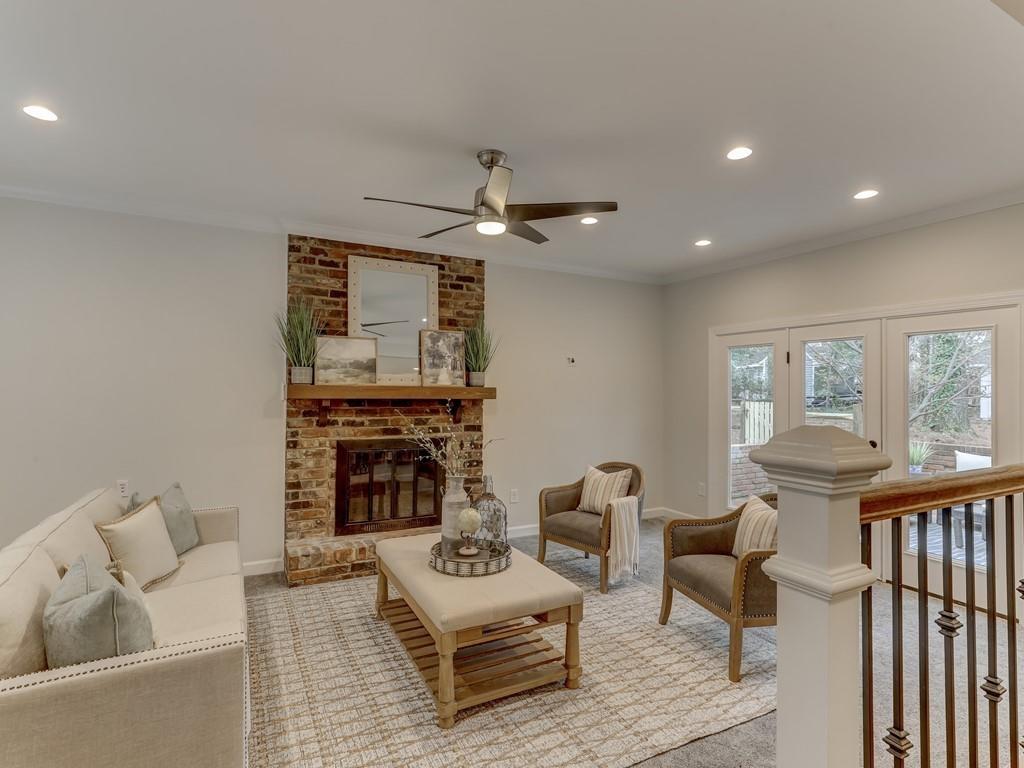 4234 Chevington Road Charlotte, NC 28226 - Photo 19 of 46 a living room with furniture and a fireplace
